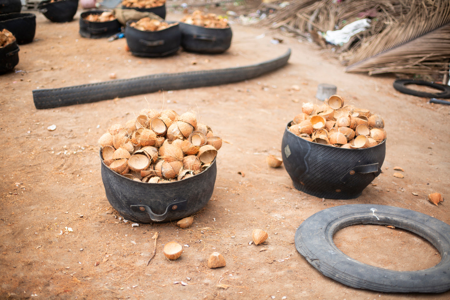 nariyal_pile_of_coconut_shells_rubber_basket_our_roots
